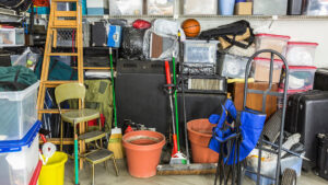 An overstuffed garage filled with various items, indicating a need for junk removal service from ABC Junk Removal & Hauling in Westfield, IN.