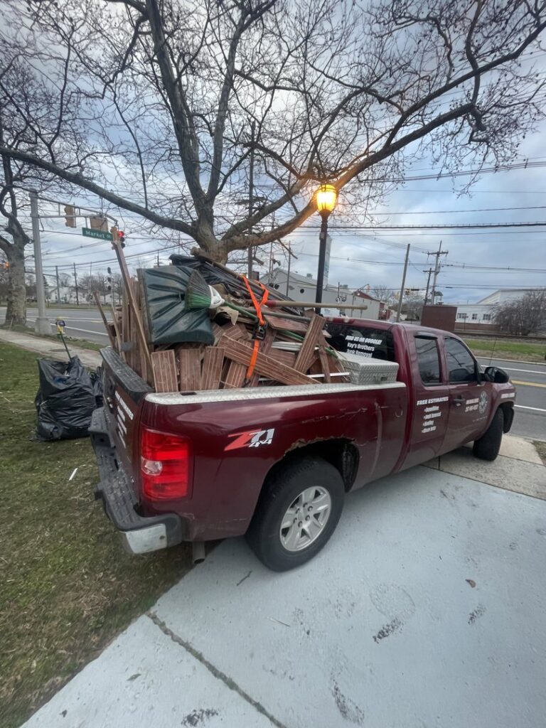 A pickup truck bed filled with various junk items, ready for removal by Kay's Brothers Junk Removal in Philadelphia, PA.