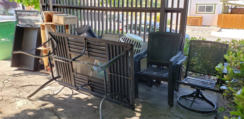 A pile of outdoor furniture and other items ready for junk removal by 24/7 Junk Removal in Rolling Hills Estates, CA.