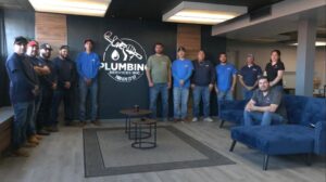The professional plumbing team of Plumbing Services Inc. gathered in their office in San Diego, CA.