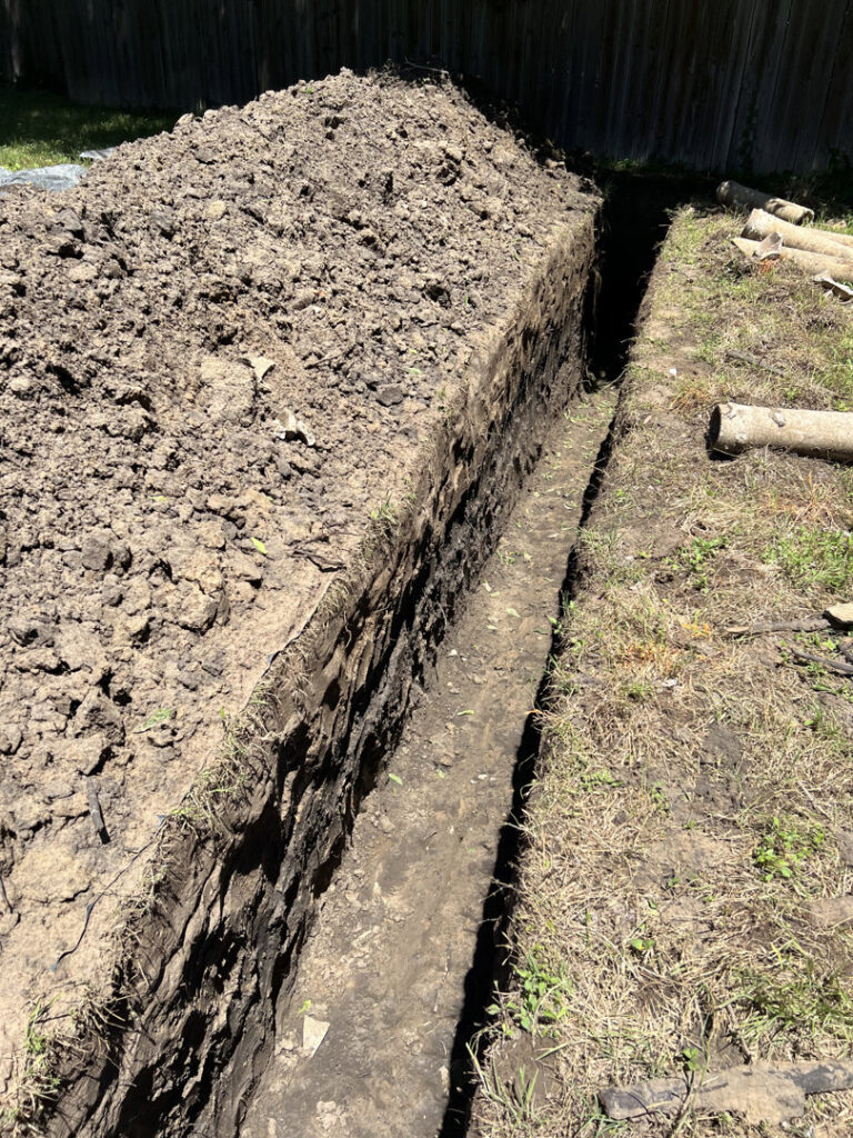 A plumbing trench dug for new pipe installation or repair by Molberg Plumbing in Ft Worth, TX