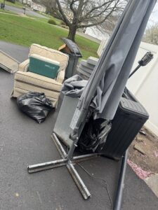 A large refrigerator being loaded onto a truck for appliance removal by High Speed Junk Removal in Levittown, PA.