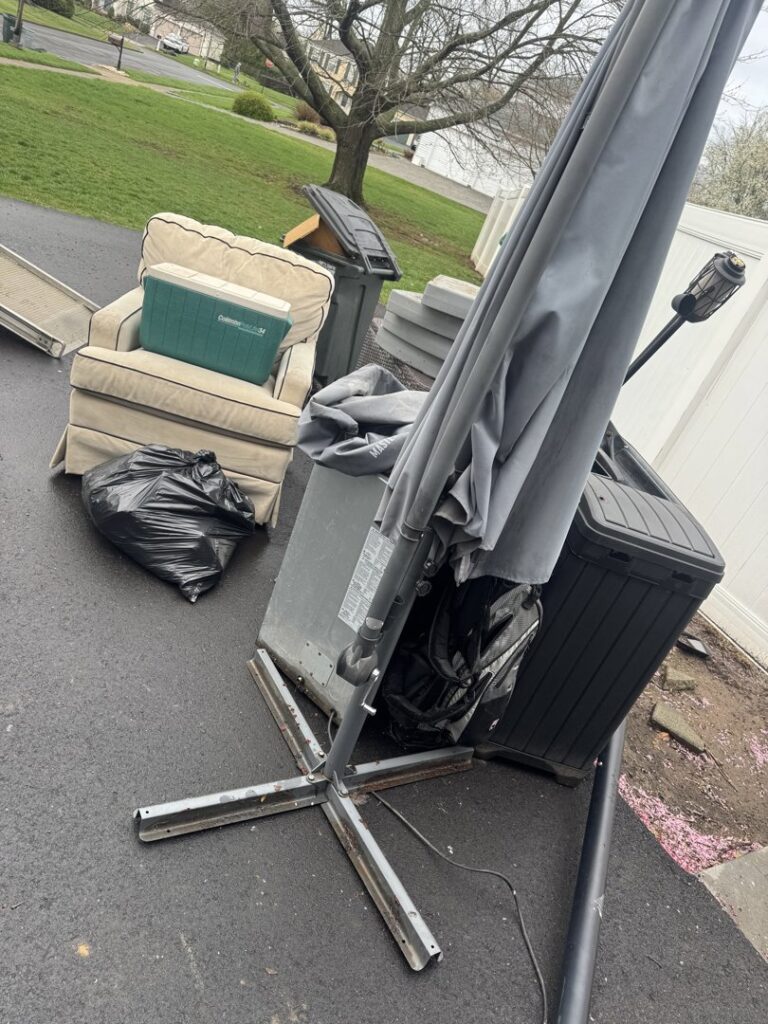 A large refrigerator being loaded onto a truck for appliance removal by High Speed Junk Removal in Levittown, PA.
