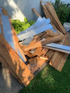 A pile of wood and metal renovation debris ready for removal by GEF Hauling and Junk Removal in Philadelphia, PA.