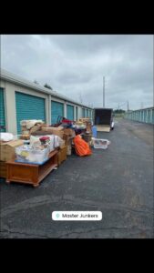 A large amount of junk and boxes piled outside a storage unit for removal by Master Junkers in Powell, OH.