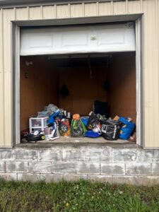 A storage unit filled with various items ready for junk removal by Big John's Demolition & Junk Removal in Charlotte, NC
