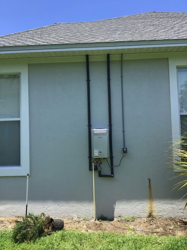 Outdoor tankless water heater installation by David Gray- Electrical Plumbing Heating & Air in Jacksonville, FL