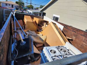 A trailer full of household appliances and debris from a junk removal job by 24/7 Junk Removal in Rolling Hills Estates, CA.