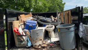 A trailer loaded with various household junk and debris, ready for removal by Get Junk Help in Houston, TX.