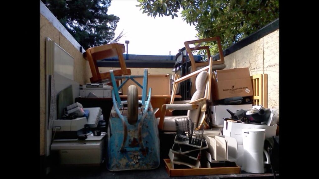 A truck bed filled with various household items and debris, ready for junk removal by Epic Junk Removal SD in San Diego, CA.