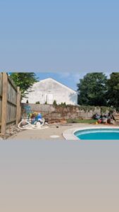 A truck bed loaded with furniture, mattresses, and various junk items for removal by We Love Junk in Philadelphia, PA.