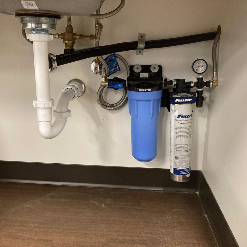 A water filtration system installed under a sink by Molberg Plumbing in Ft Worth, TX
