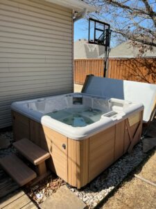 Piles of wood planks and concrete debris in a yard, indicating a junk removal job by All Needz Junk Removal & Hauling Service in Dallas, TX.