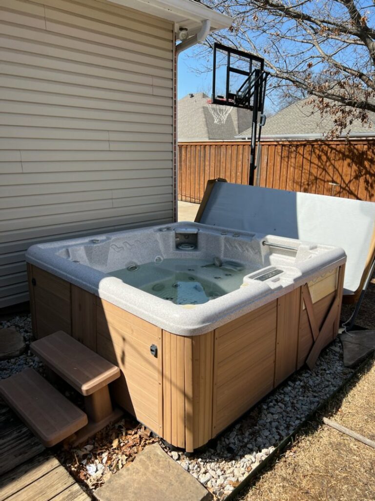 Piles of wood planks and concrete debris in a yard, indicating a junk removal job by All Needz Junk Removal & Hauling Service in Dallas, TX.