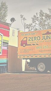 A large pile of wooden pallets ready for removal by Zero Junk, offering commercial junk services in San Jose, CA.