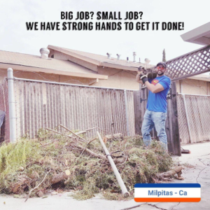 A worker hauling yard debris for Strong Hands Hauling & Dumpster Rental in San Jose, CA