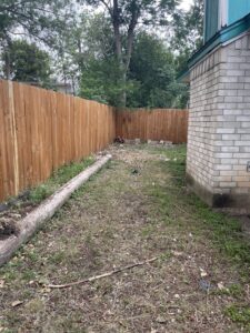 Junk King San Antonio Northwest workers loading various metal items and debris into a junk removal truck in San Antonio, TX.
